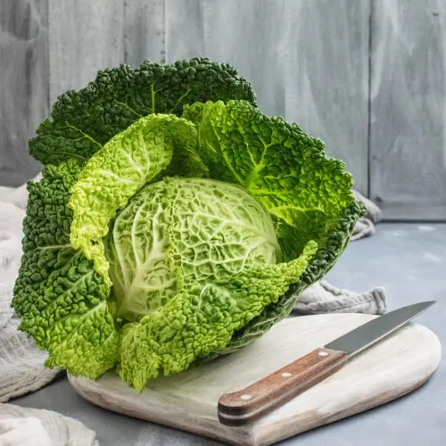 cabbage on cutting board with knife