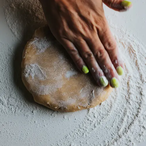 hands working dough