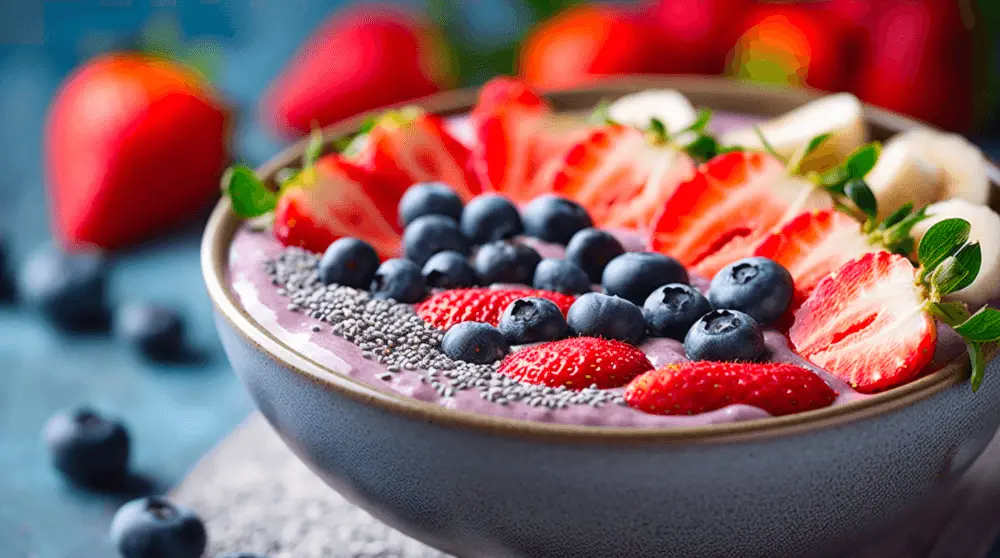 a pitaya bowl with fruit and nuts