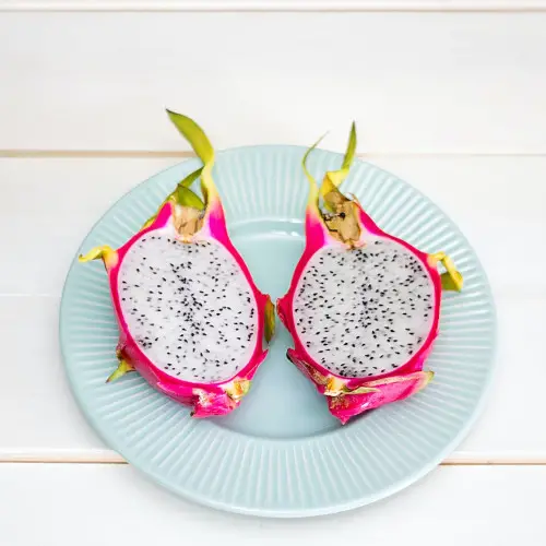 cut open dragonfruit on a plate